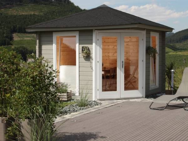 Wolff Finnhaus 5-Eckhaus Katrin 58-A mit grünen Dachschindeln und Dachhaube Wolff Finnhaus 5-Eckhaus Katrin 58-A mit grünen Dachschindeln und Dachhaube